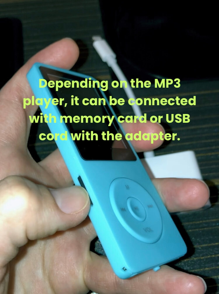 Connecting MP3 player to iPhone with adapter. 